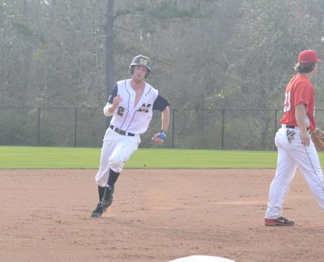 Garrett Odom rounds third & heads for home against Jeff Davis Feb. 18.
